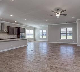 Open Concept Living Area Large Windows Natural Light