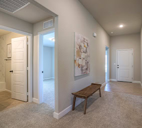 Hallway With Bench And Artwork