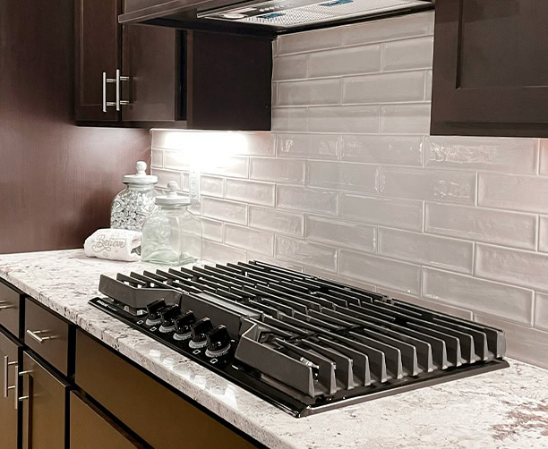 Modern Gas Cooktop Marble Counter Subway Tile Backsplash