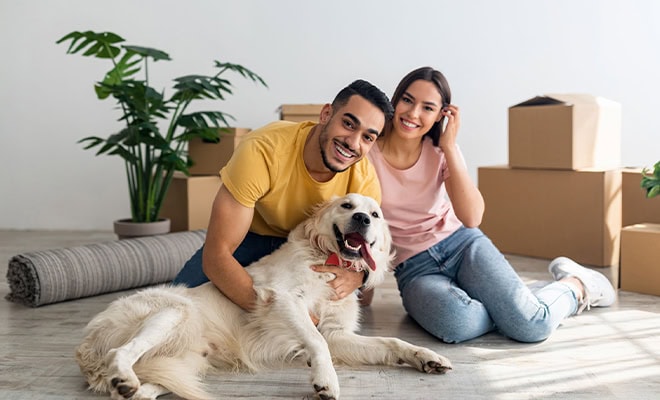 Couple With Dog Moving Day New Home Lifestyle