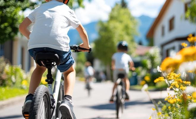 Children Biking In Suburban Neighborhood