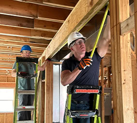 Female Volunteer Smiling Construction Site